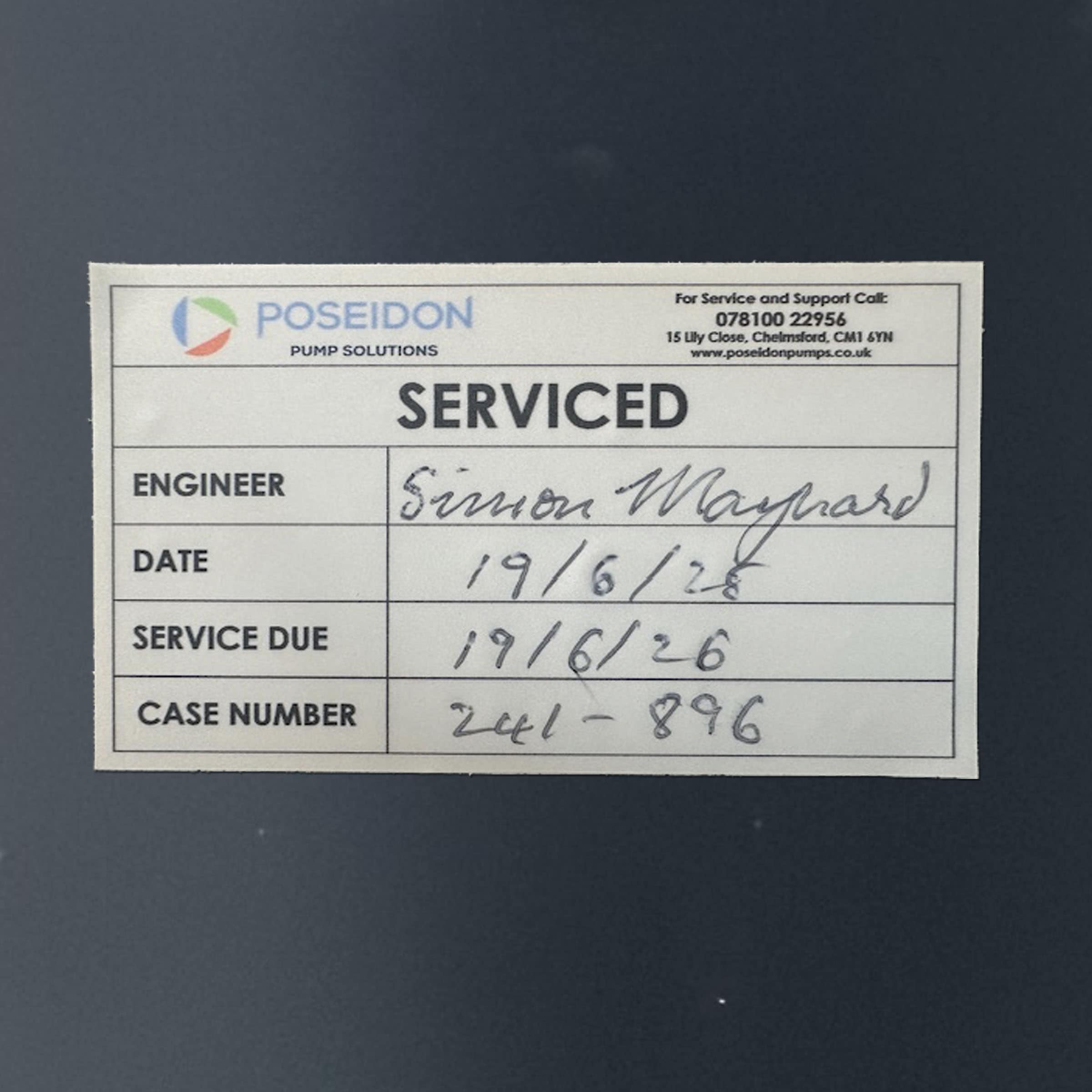 Service label with engineer details and dates.
